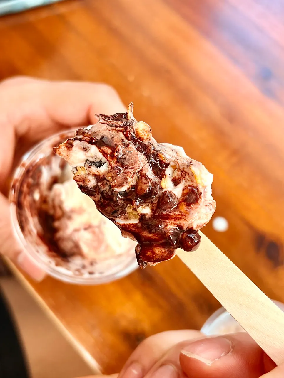 Ice cream cup with granola lining the bottom