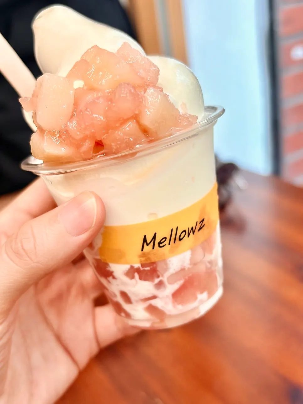 Soft serve topped with peach flesh