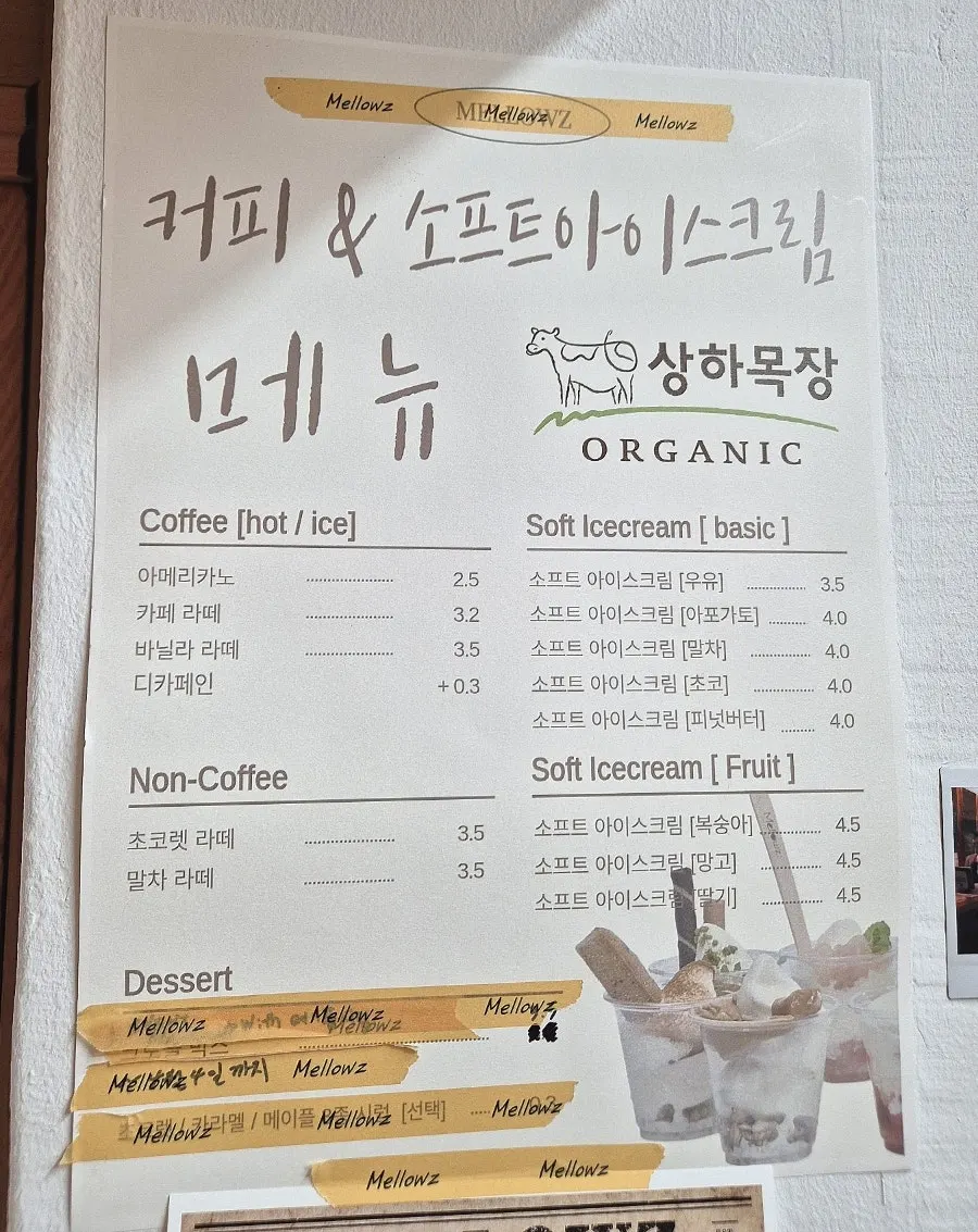 Mellows menu board listing coffee and non-coffee drinks