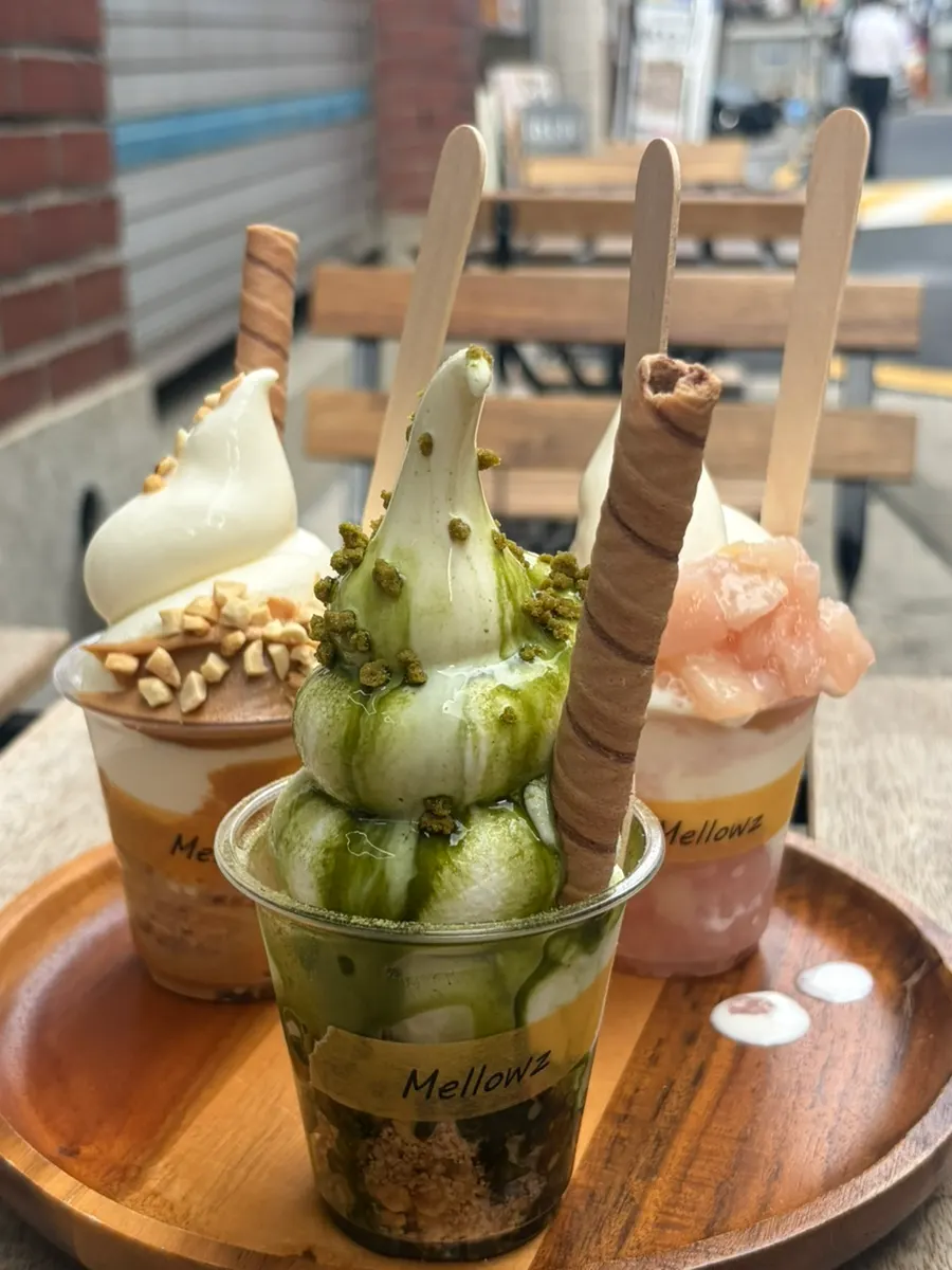 Peach, peanut butter, and matcha ice cream side by side