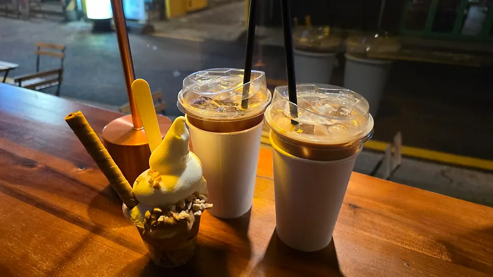 Mellows' outdoor seating with the Seongsu alley at night