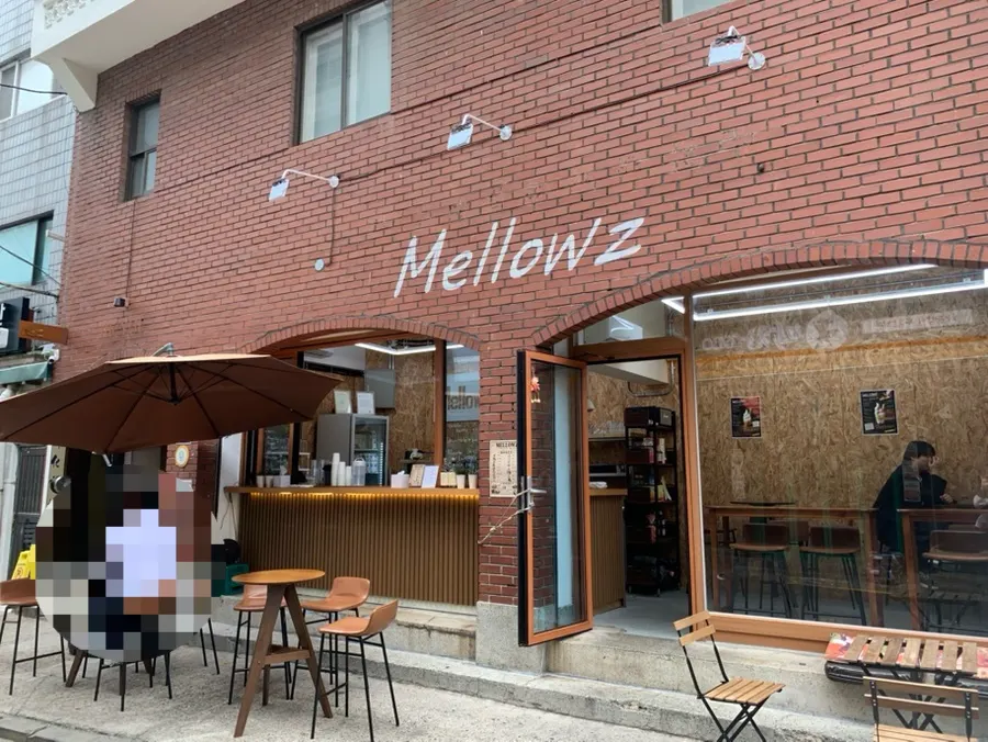 Red brick exterior with the Mellowz sign