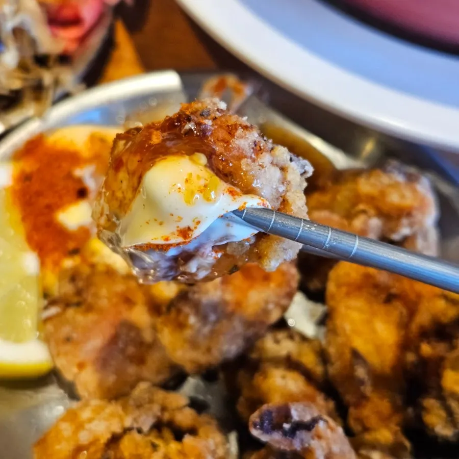 Cross-section of karaage dipped in sauce