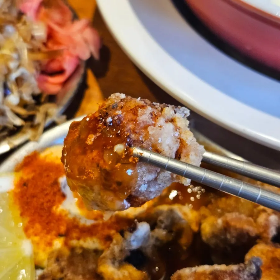 A plate of homemade chicken karaage with lemon