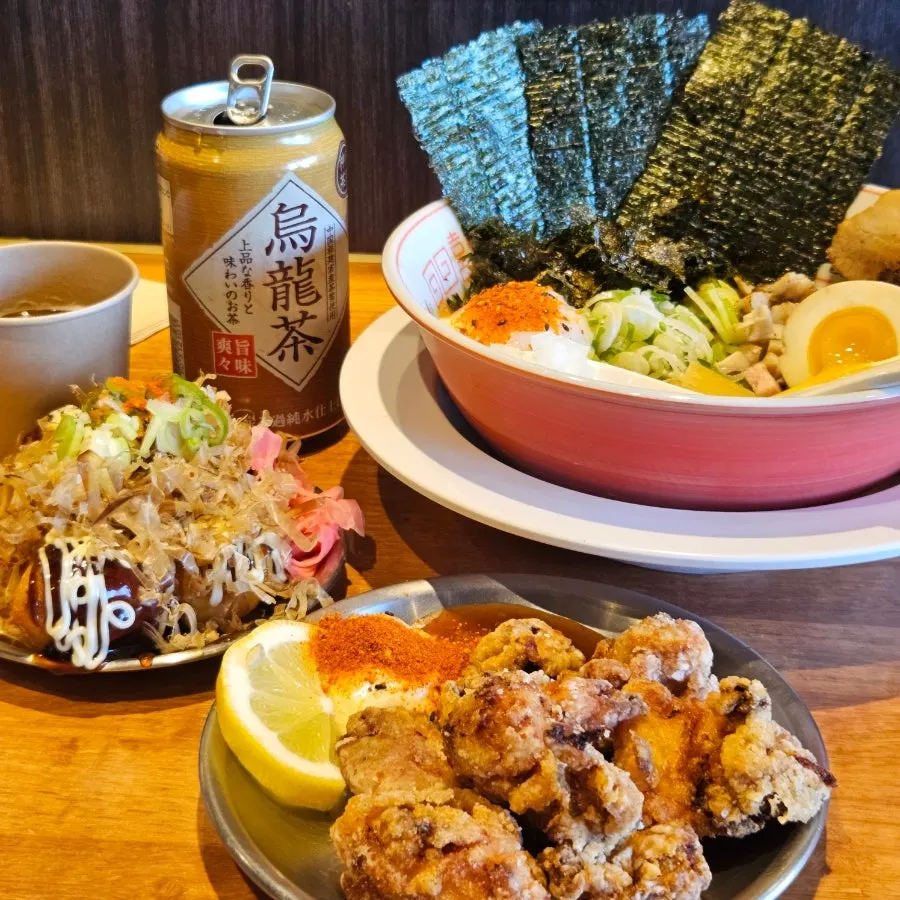 A spread of abura soba, karaage, and takoyaki