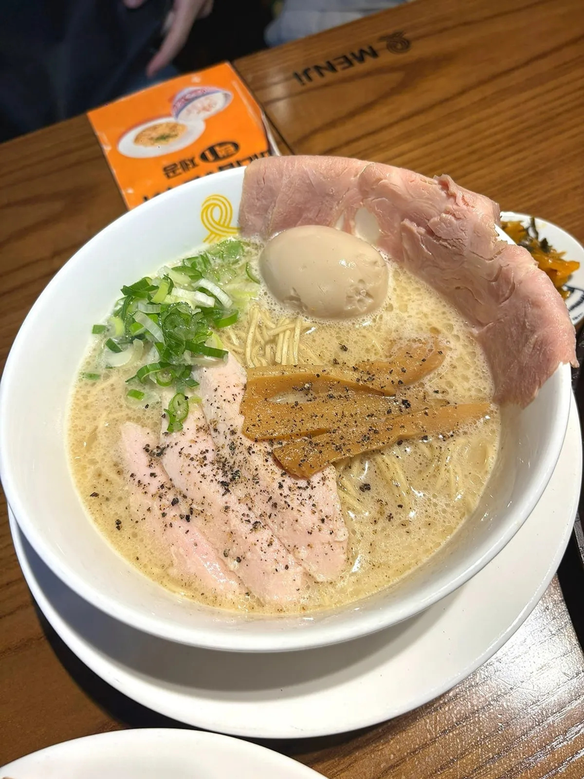 Tori paitan ramen, kara tantanmen, and pork loin tonkatsu set on one table