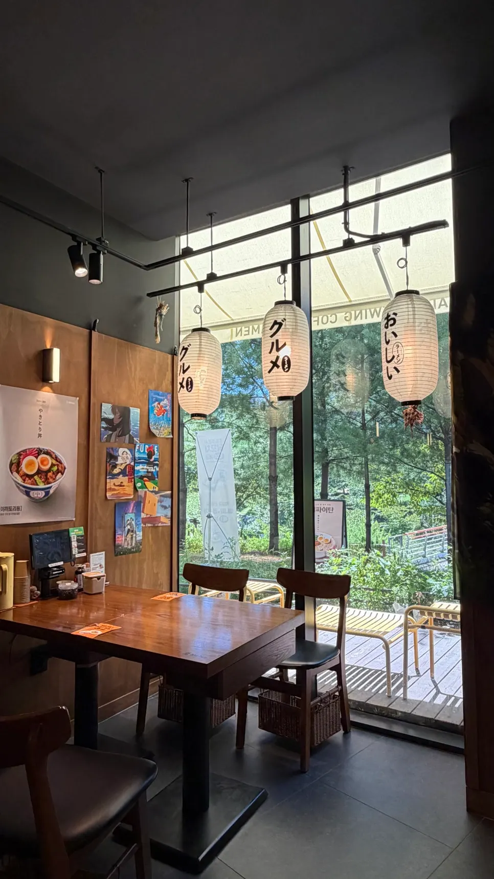 Seating area with a view of the riverside park through the window