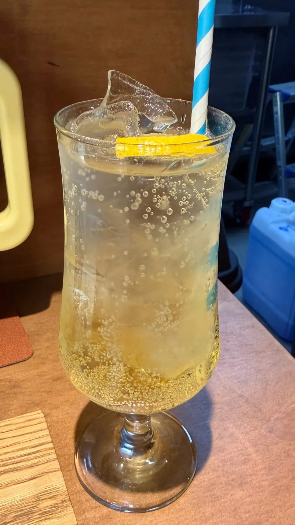 A glass of lemon soda served first