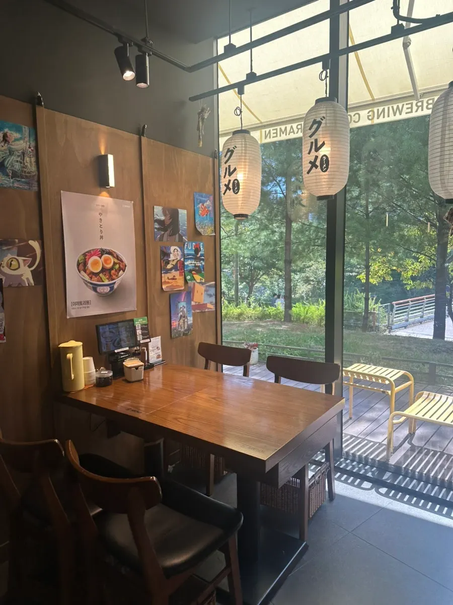 Interior of Menji Hanam Misa Branch with a Japanese ramen shop feel