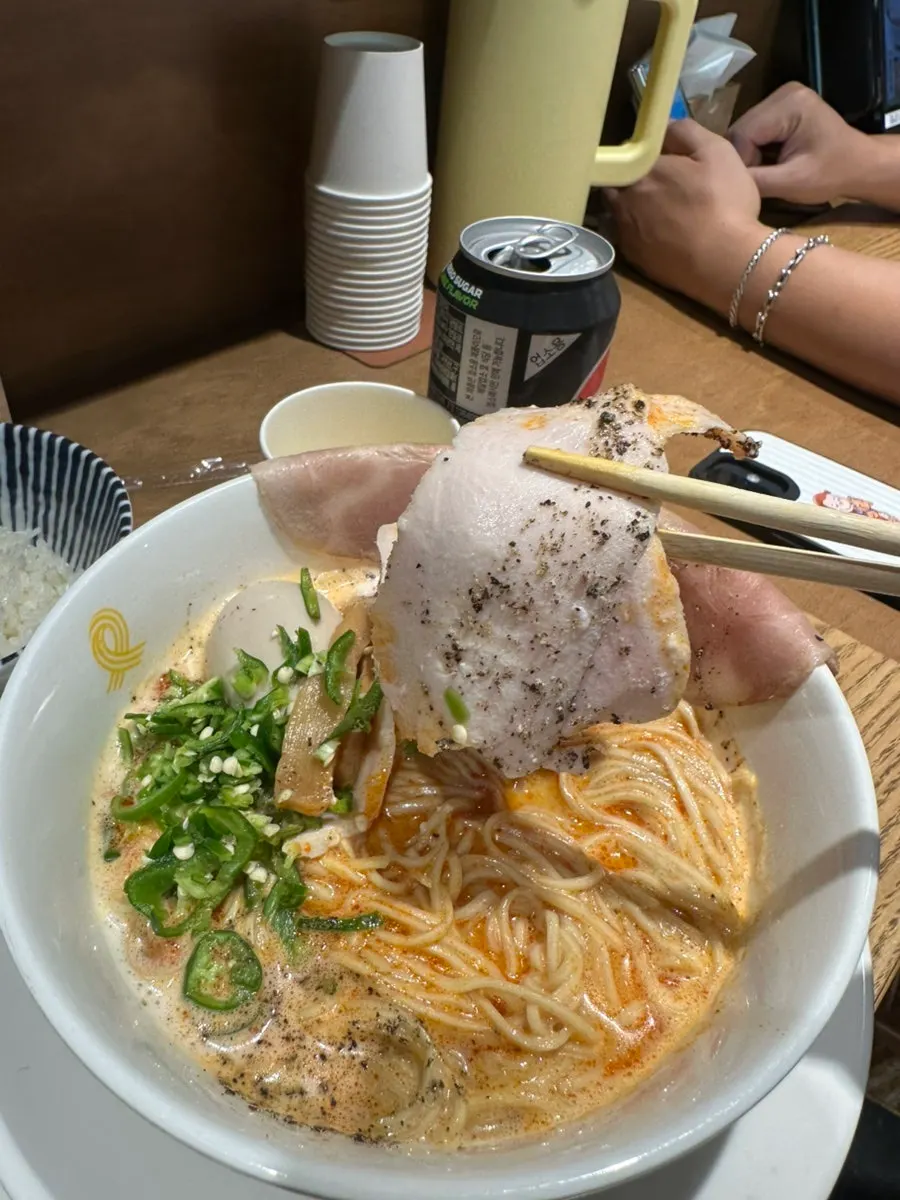 Close-up of ttangcho tori paitan ramen noodles and toppings