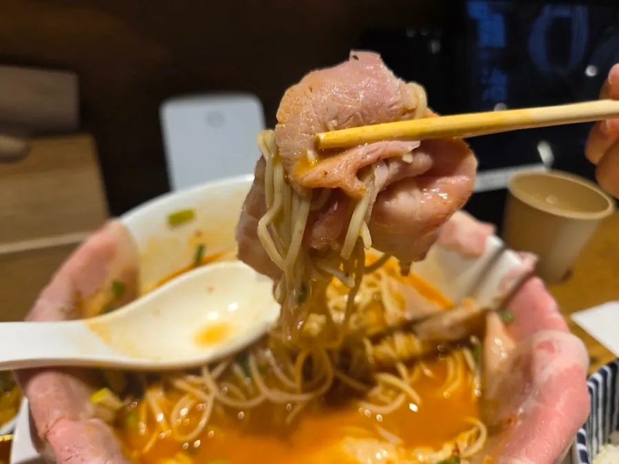House-made noodles lifted out of the kara tantanmen