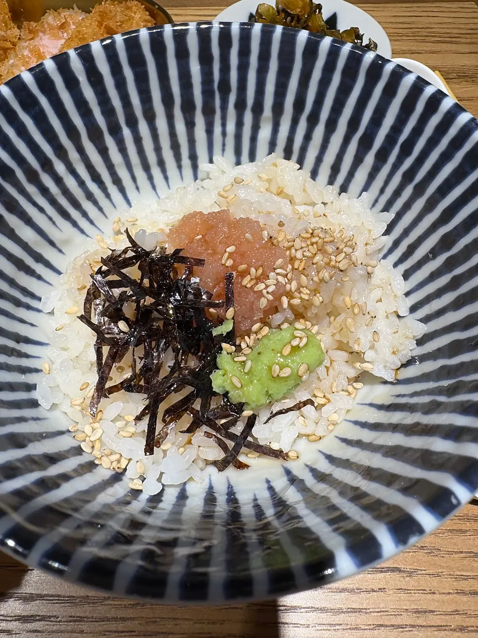 Full ramen set laid out at the bar seat