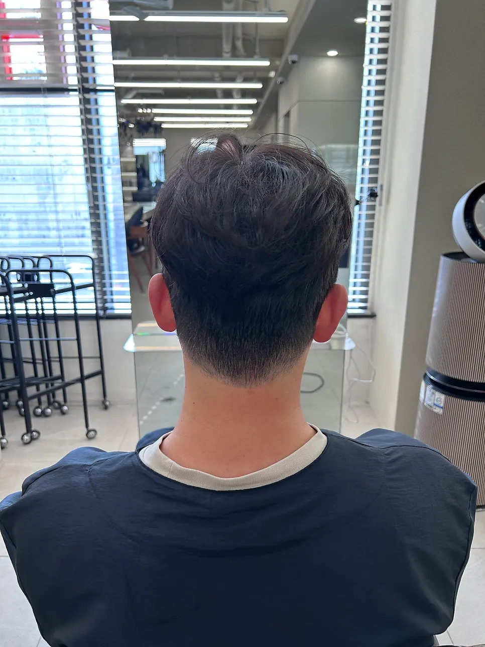 Finished men's design perm with bangs swept up