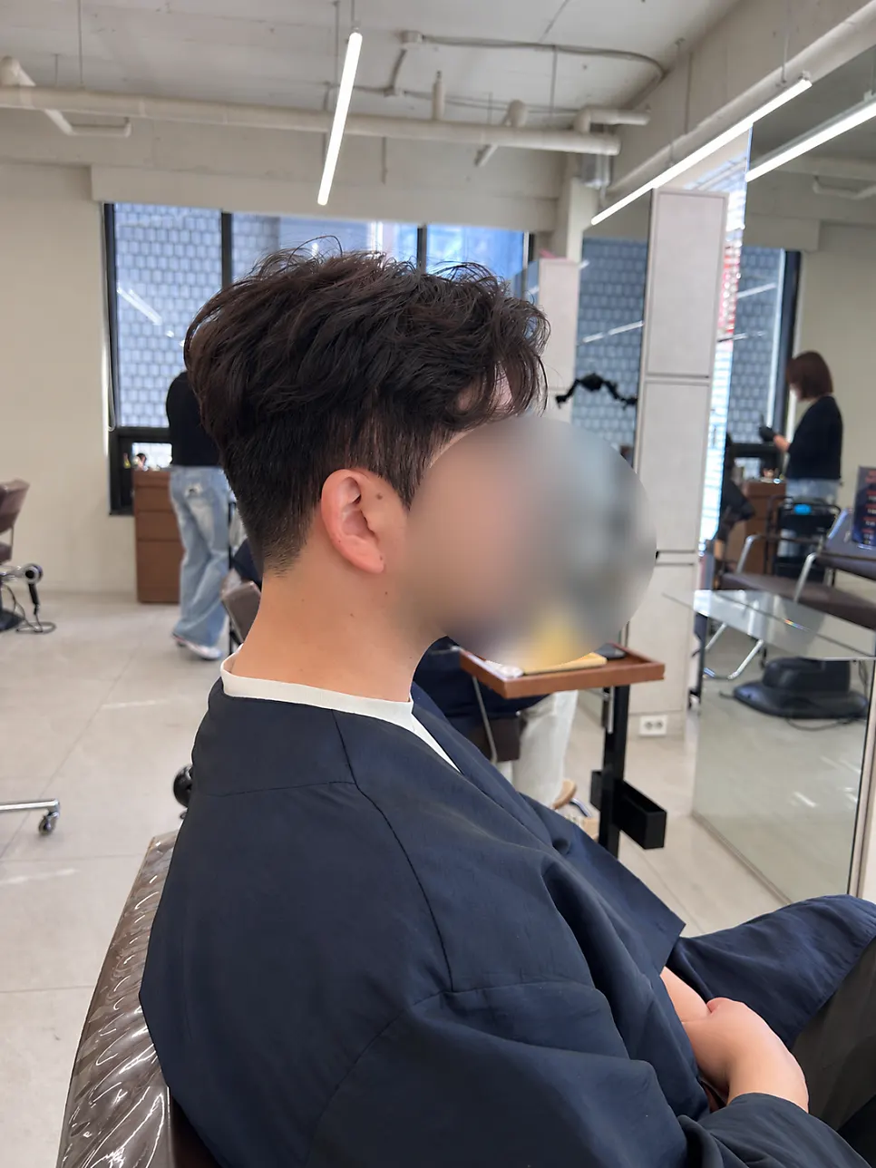 Side view of the styled men's perm with revived volume