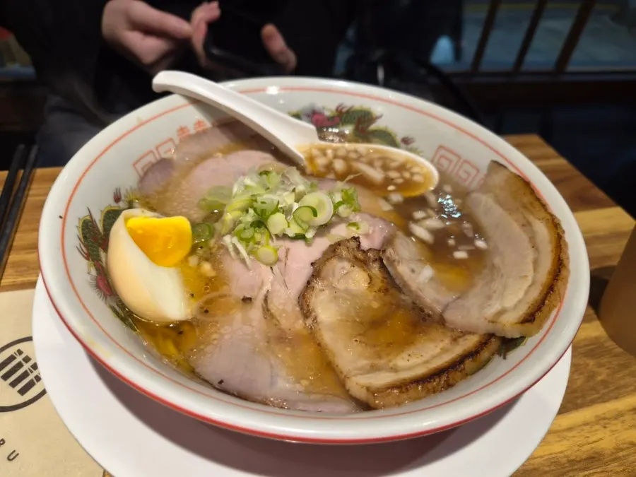 Broth and noodles of the signature ramen