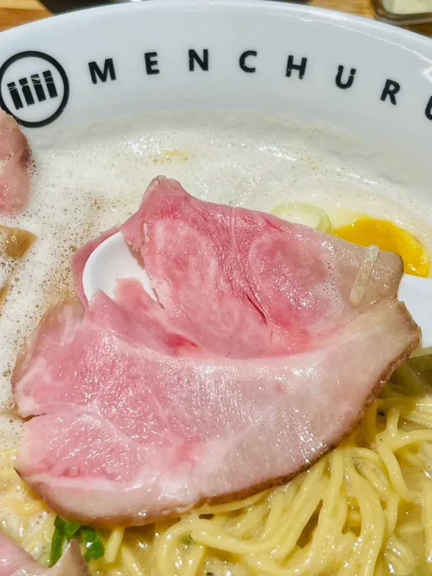 A single large chashu slice nearly the size of the bowl