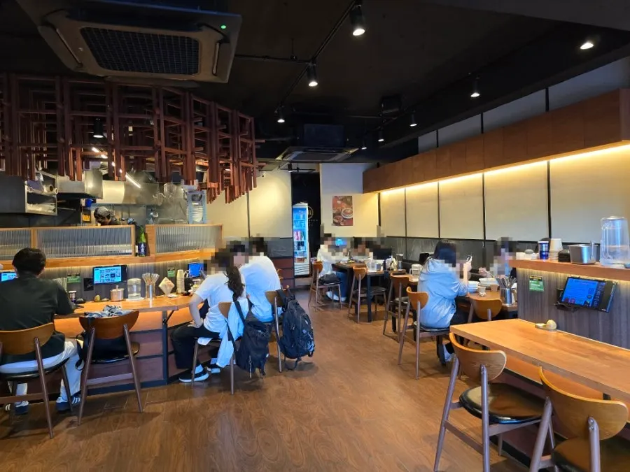Interior of Mentsuru Children's Grand Park Branch with wood-toned decor