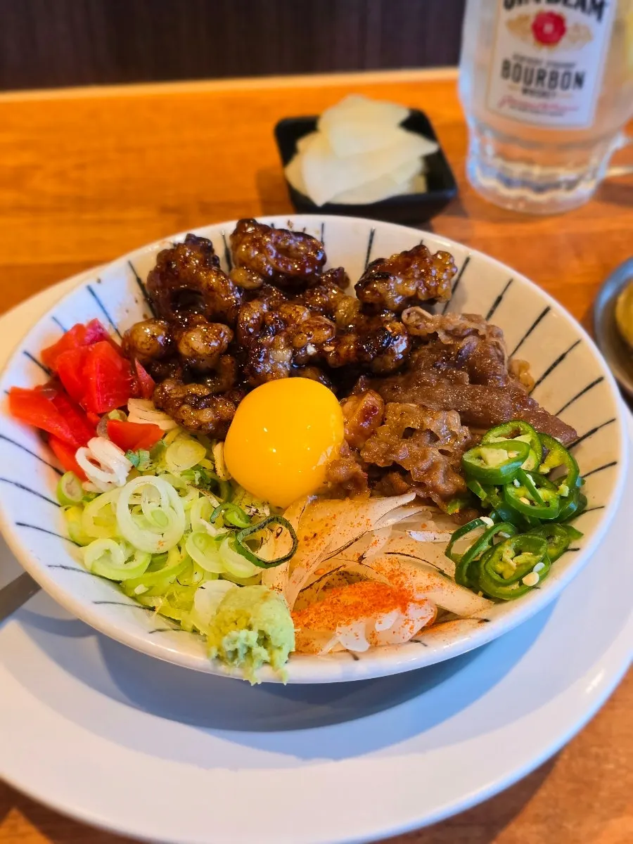 Mentsuru's hormone-don topped with egg yolk
