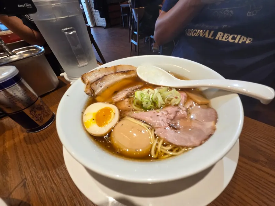 Broth and fresh noodles in the shoyu ramen