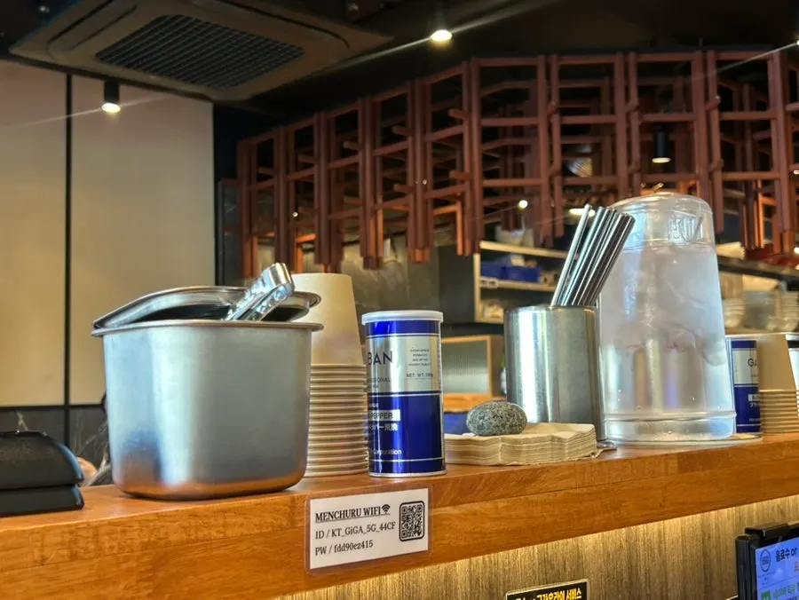Seasoning caddy with pepper set on the side of the table