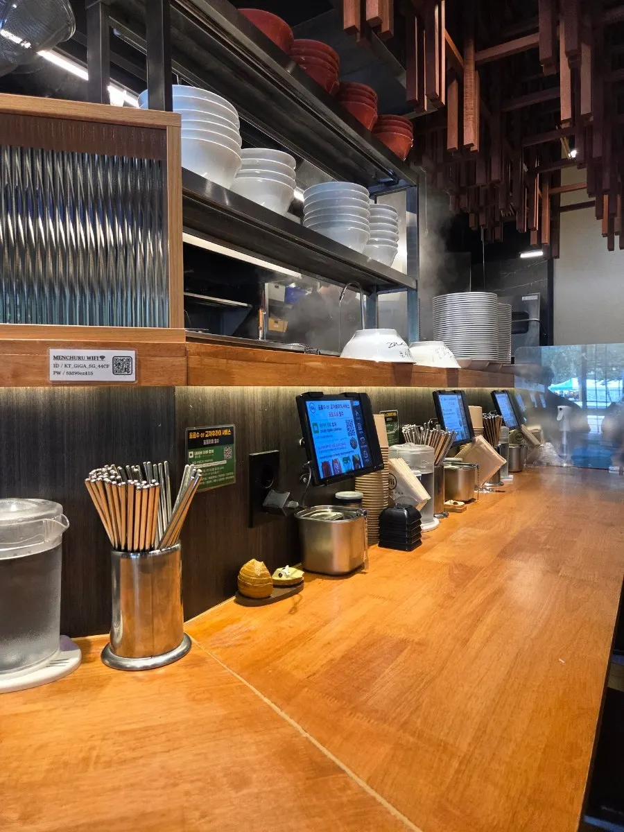 Bar seating facing the kitchen counter