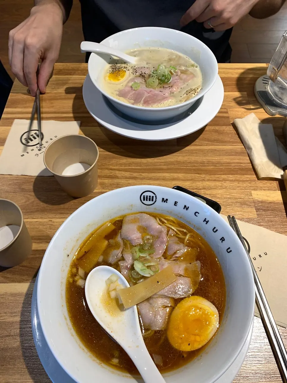 Table waiting for two bowls of ordered ramen