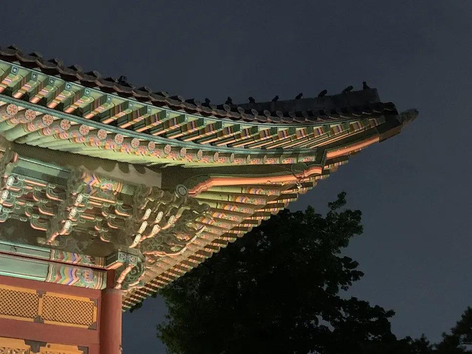 A lit-up pavilion at Deoksugung at night