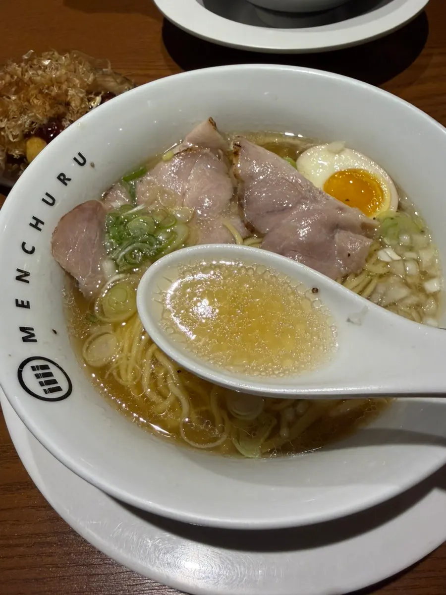 Shio ramen topped with chashu, soft-boiled egg, and menma
