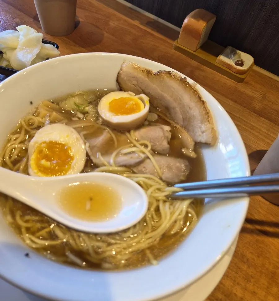 Close-up of shoyu ramen noodles and broth