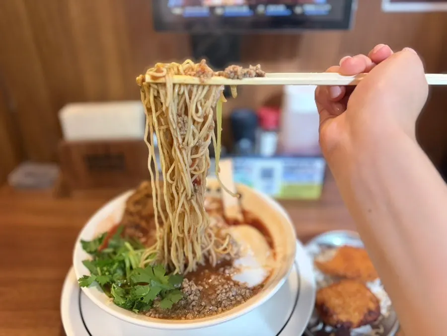Soft-boiled egg and cilantro on a spoon