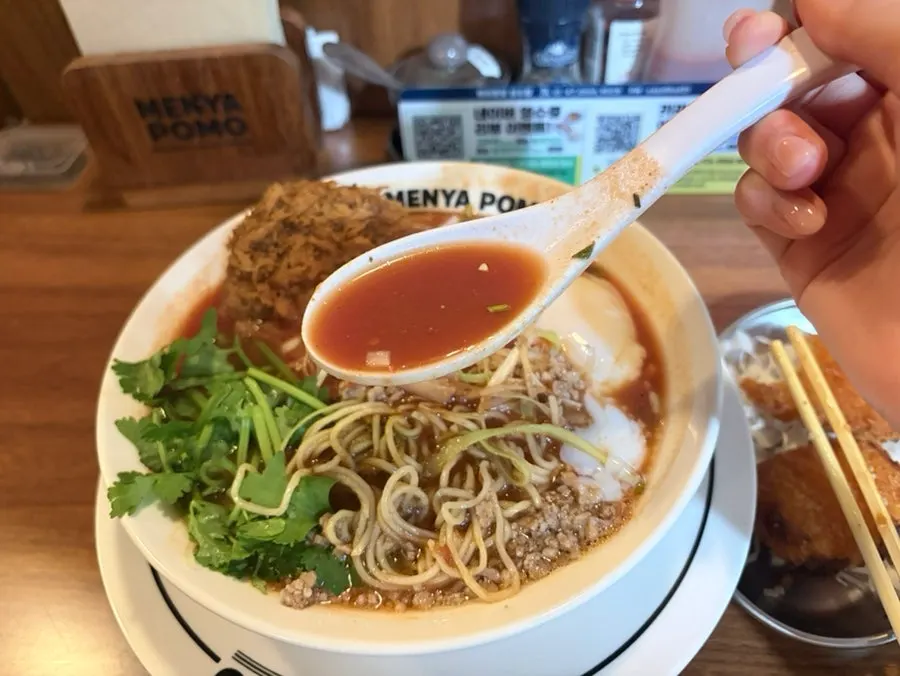 Noodles lifted up, well mixed with the broth
