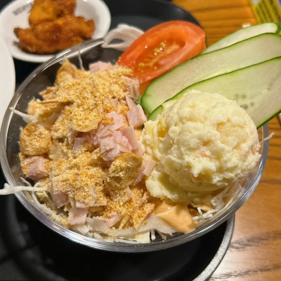 Two bowls of beef cutlet ramen sets with sides