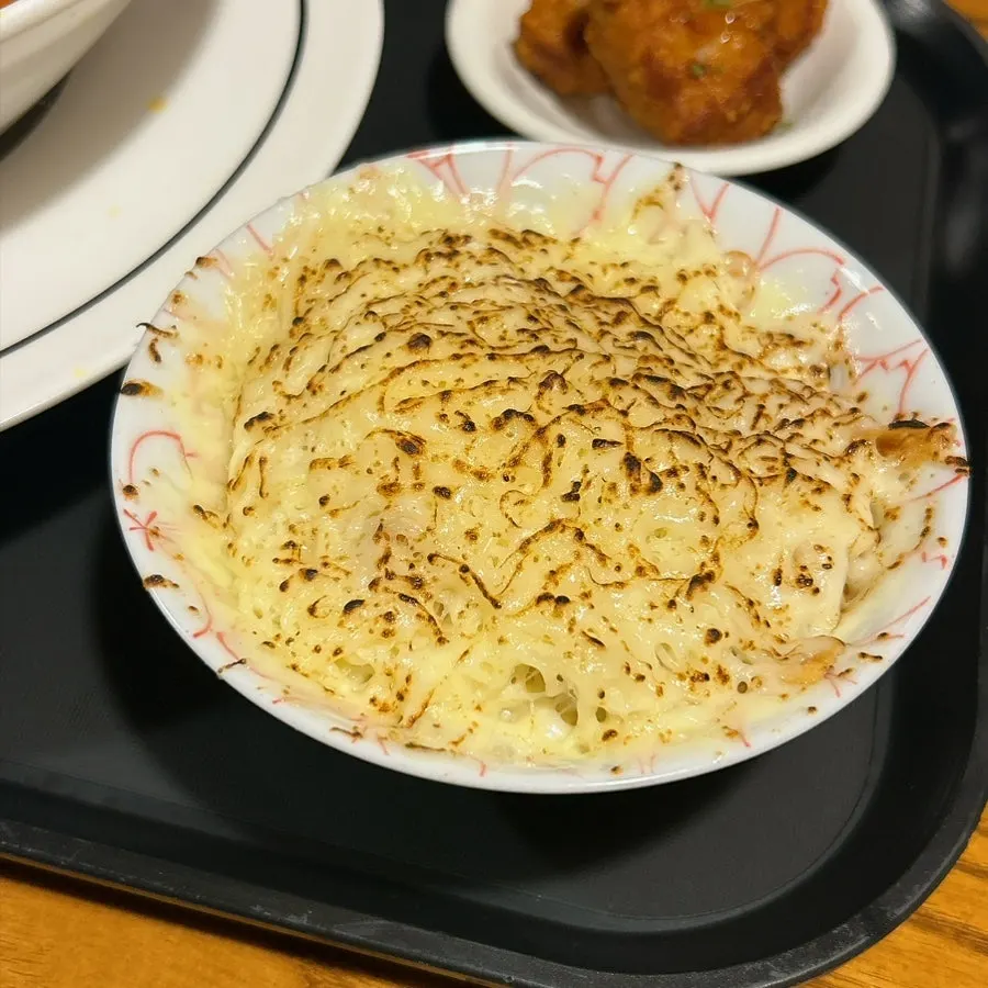 Tantan beef cutlet ramen topped with snow cheese