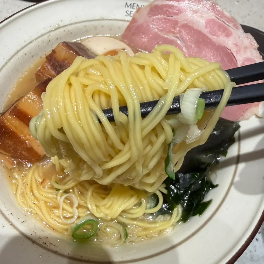 Noodles lifted from the mild dongpo pork ramen