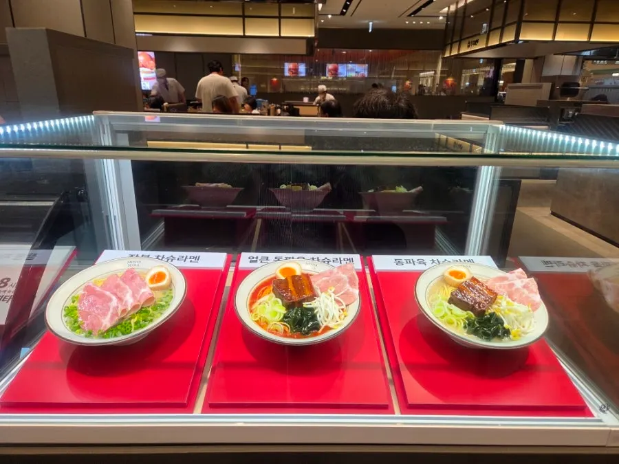 Menu display models set up in front of Menya Seoul