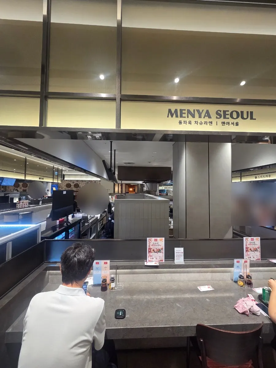 Interior seating and ordering area of Menya Seoul