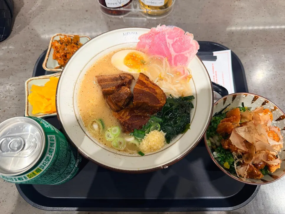 Table spread of dongpo pork ramen and sweet soy chicken rice bowl set