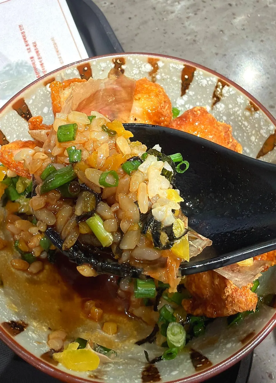 Eating the ramen and rice bowl set together