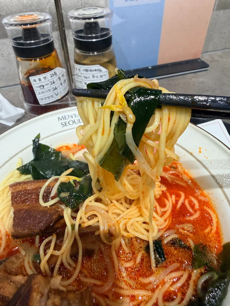 Ramen broth with lauyu chili oil drizzled on top