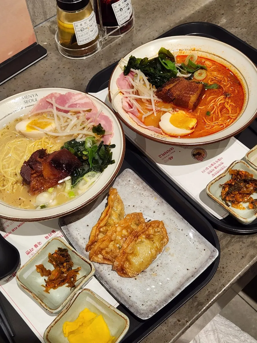A bowl of Menya Seoul ramen topped with dongpo pork
