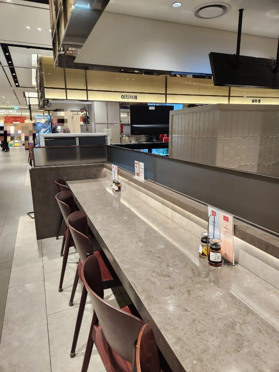 Long bar table seating at Menya Seoul