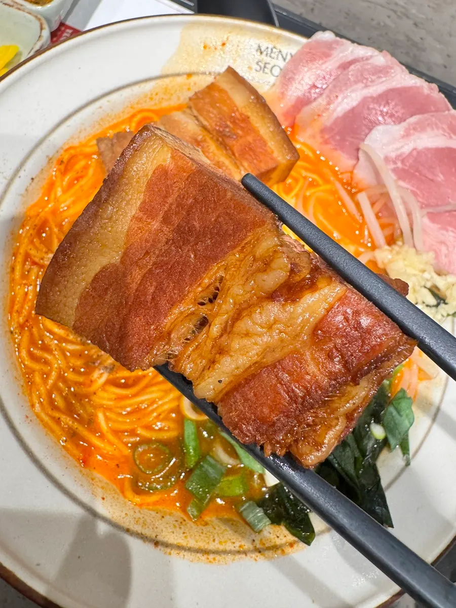 Thick slice of dongpo pork char siu on top of the ramen