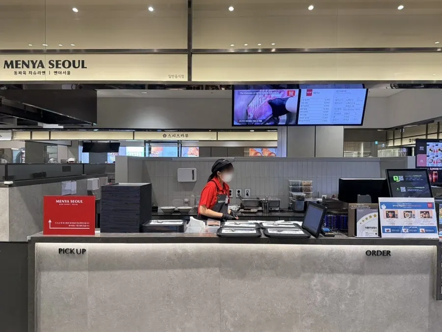 Front of the store at Menya Seoul with the order counter