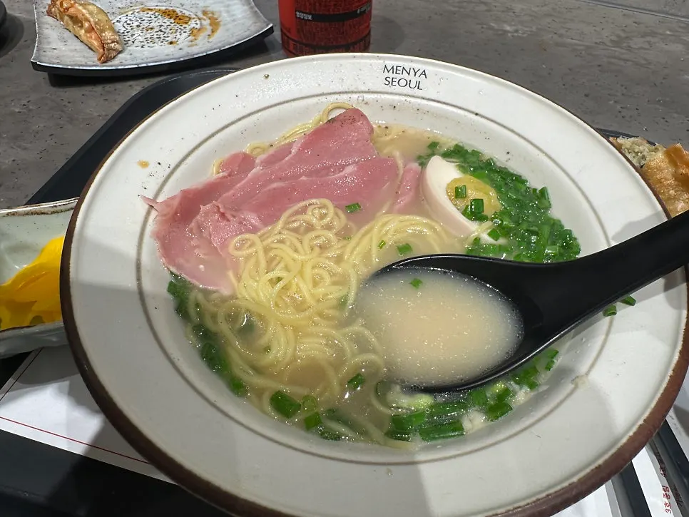 A bowl of jambon ramen in mild tonkotsu broth