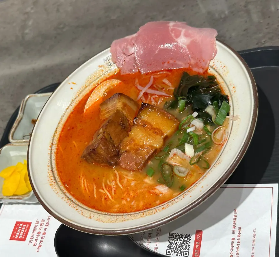 Spicy broth ramen topped with dongpo pork and jambon