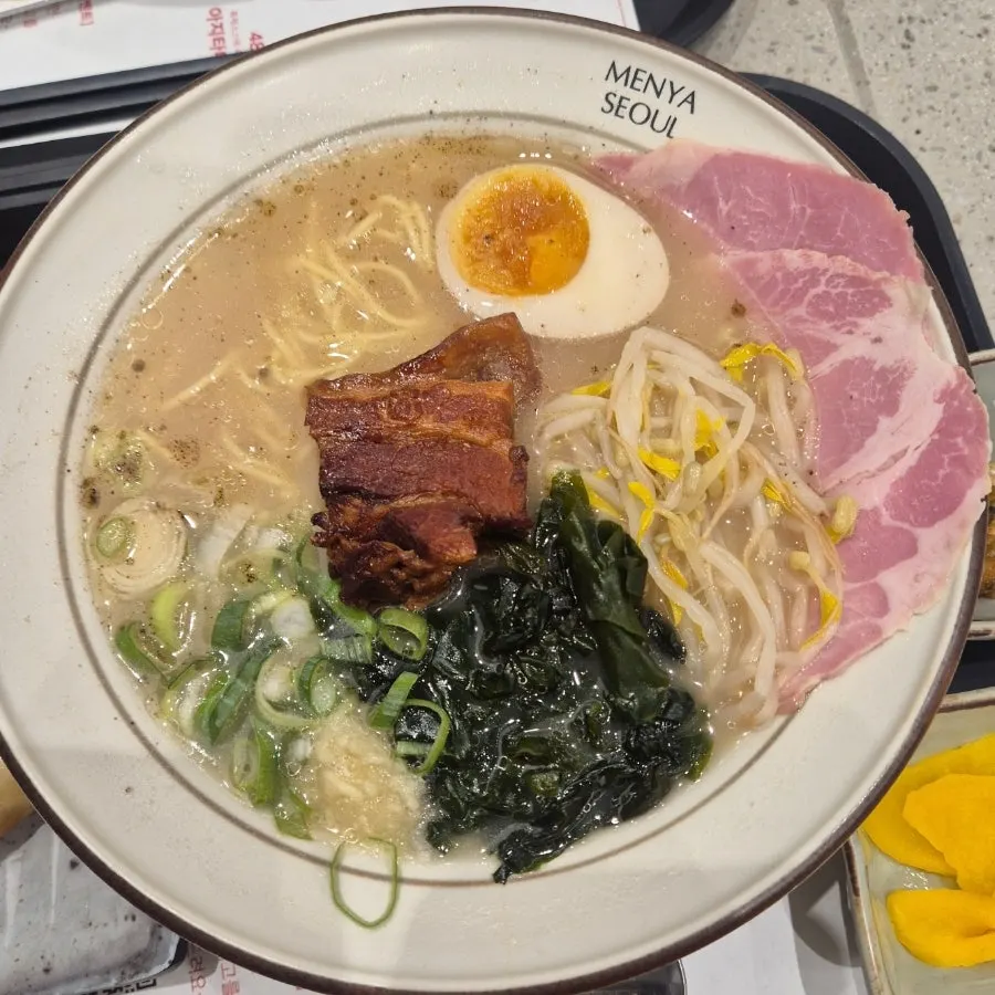 A bowl of dongpo pork char siu ramen on the table