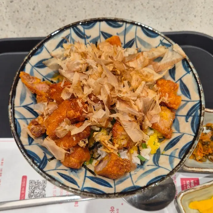Sweet soy chicken rice bowl topped with bonito flakes