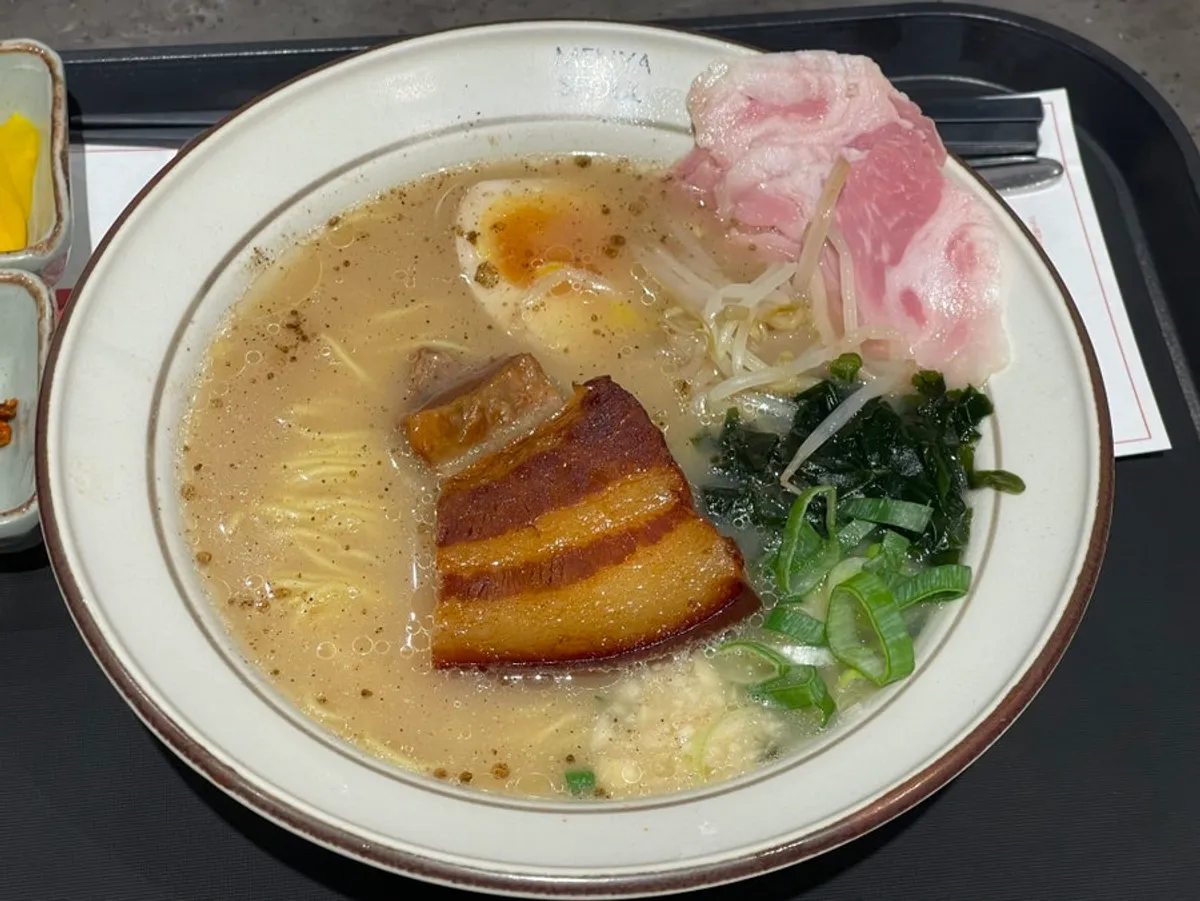 A spread of dongpo pork ramen in mild broth and king shrimp cold ramen