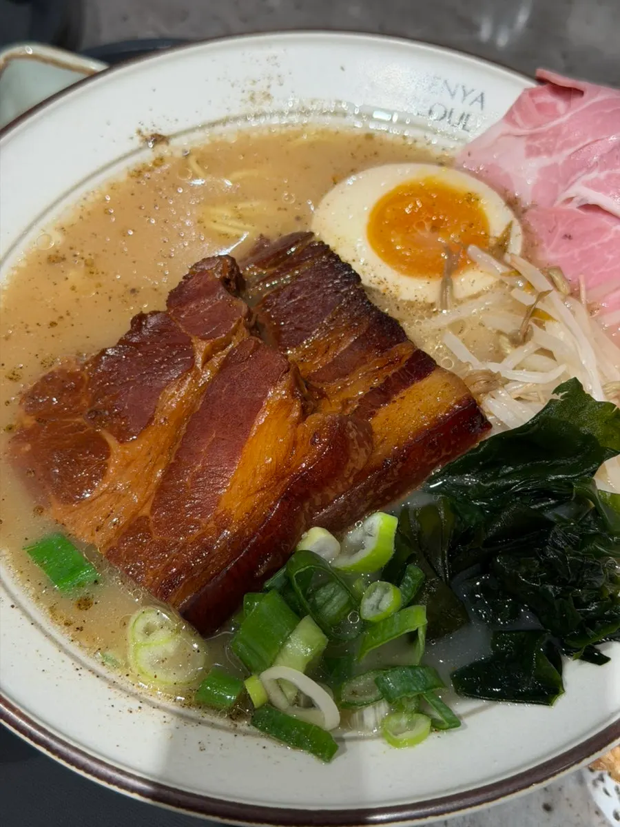 Dongpo pork ramen topped with kelp and bean sprouts