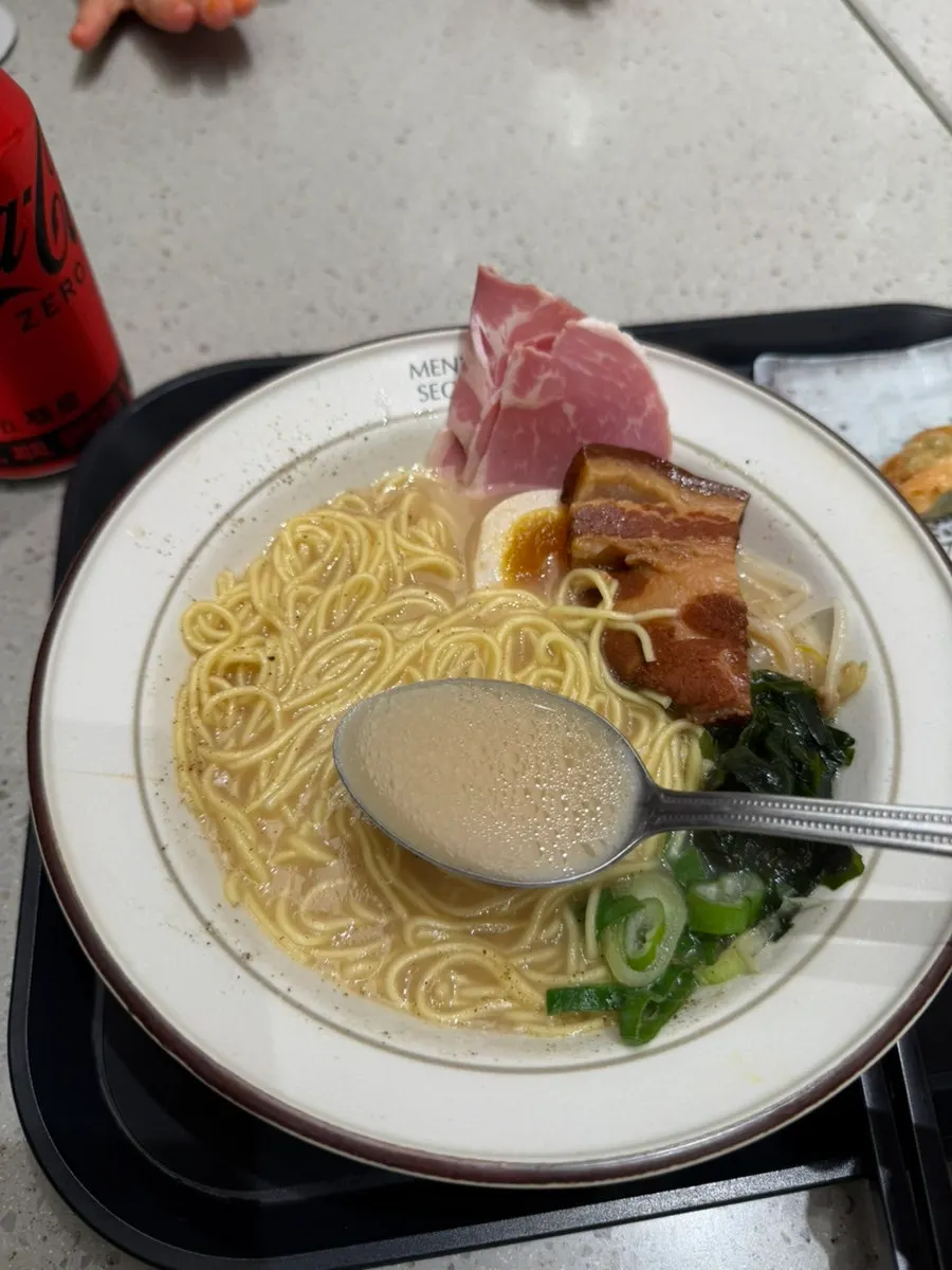 Thin noodles lifted from the dongpo pork ramen